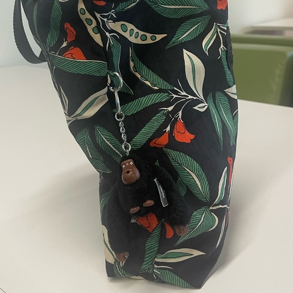 A Kipling purse featuring a cute sheep charm and a decorative pattern - Picture 2 of 2